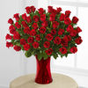Fifty Red Roses arranged in Red Vase